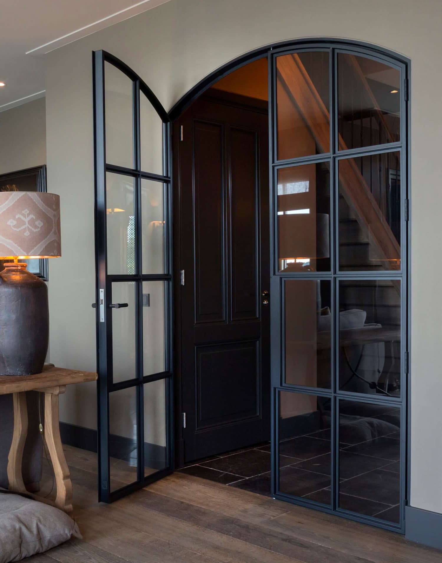 arched steel door in a traditional interior