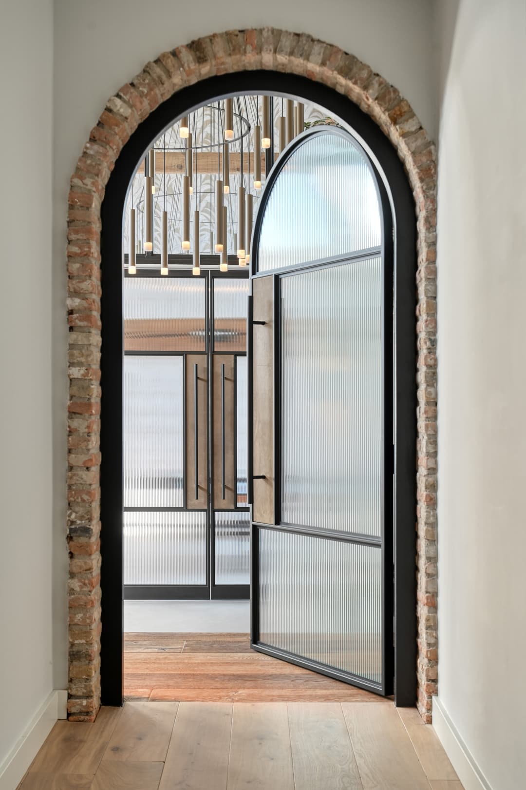 Egerton arched 3 panel steel glazed door with ribbed fluted glass and large pull handle